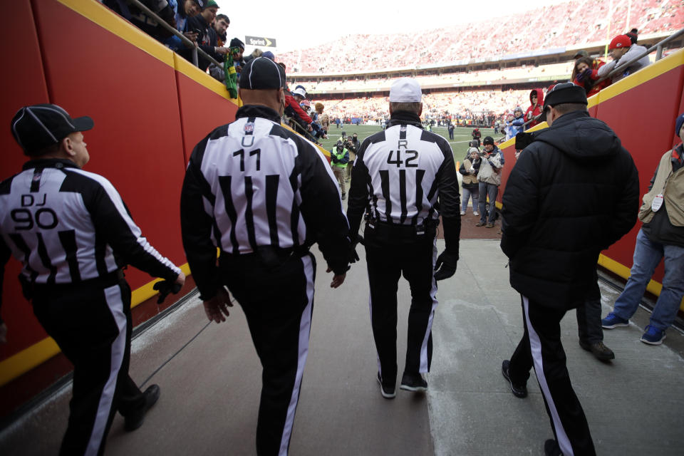 NFL officials walk in the tunnel before an NFL wild-card playoff football game between the Kansas City Chiefs and the Tennessee Titans. (AP)