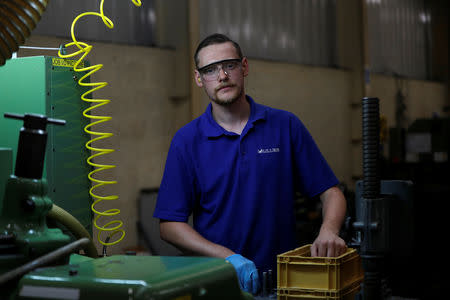 Grinding section Lead Hand James Gibbs poses at the Muller manufacturing facility in Redditch, Britain August 28, 2018. Picture taken August 28, 2018. REUTERS/Darren Staples