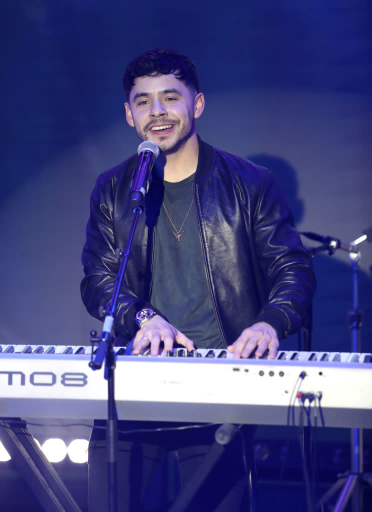 david singing and playing the keyboard