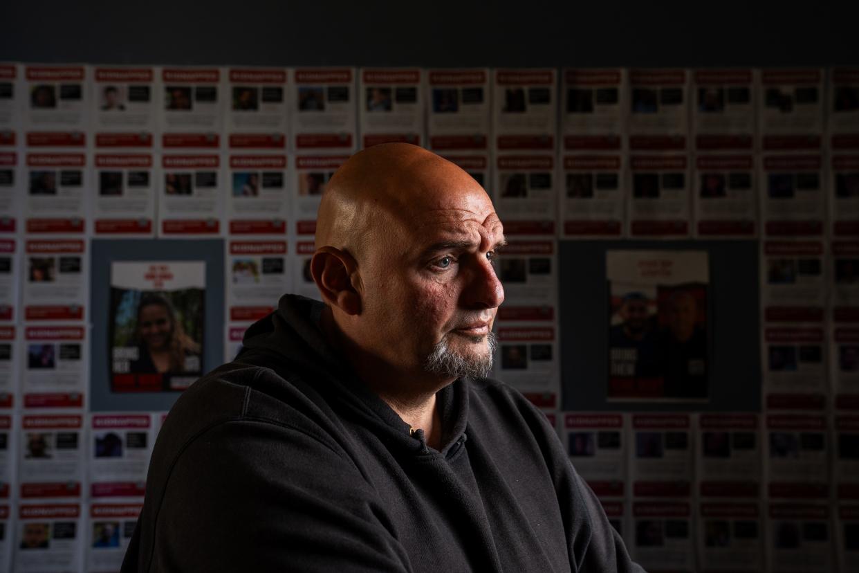 May 2, 2024; Washington, DC, USA; Sen. John Fetterman (D-Penn.) poses for a portrait in front of posters of Israeli hostages in his front office at the U.S. Capitol Thursday, May 2, 2024 . Mandatory Credit: Josh Morgan-USA TODAY