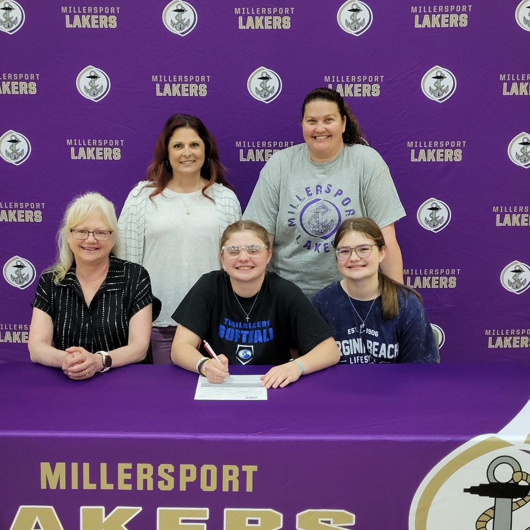 Veronica Rarey, Millersport Senior Softball Standout, will play softball at Ohio Christian University next spring. She recently signed her letter of intent. Pictured seated left to right, are mother Mindy Rarey, Veronica Rarey (center), and sister Deanna Rarey. Standing left to right are assistant softball coach Michelle Peters, and head varsity softball Coach Maria Chandler.