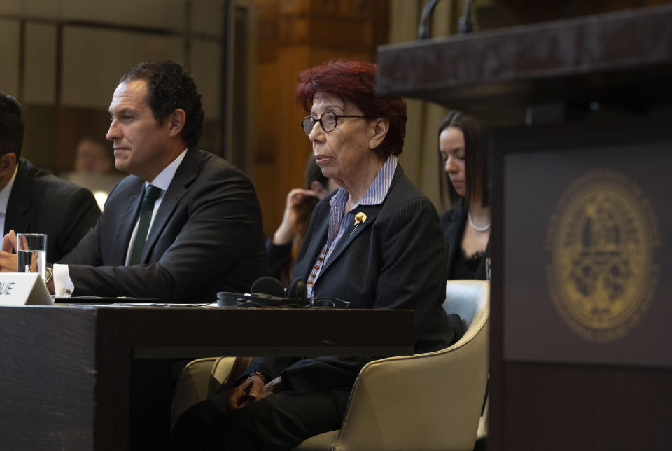 Mexico's agent and ambassador Carmen Moreno Toscano, center, and legal advisor Alejandro Celorio Alcantar, left, wait for judges to enter the International Court of Justice in The Hague, Netherlands, Tuesday, April 30, 2024, where Mexico is taking Ecuador to the United Nations' top court accusing the nation of violating international law by storming into the Mexican embassy in Quito and arresting former Ecuador Vice President Jorge Glas, who had been holed up there seeking asylum in Mexico. (AP Photo/Peter Dejong)