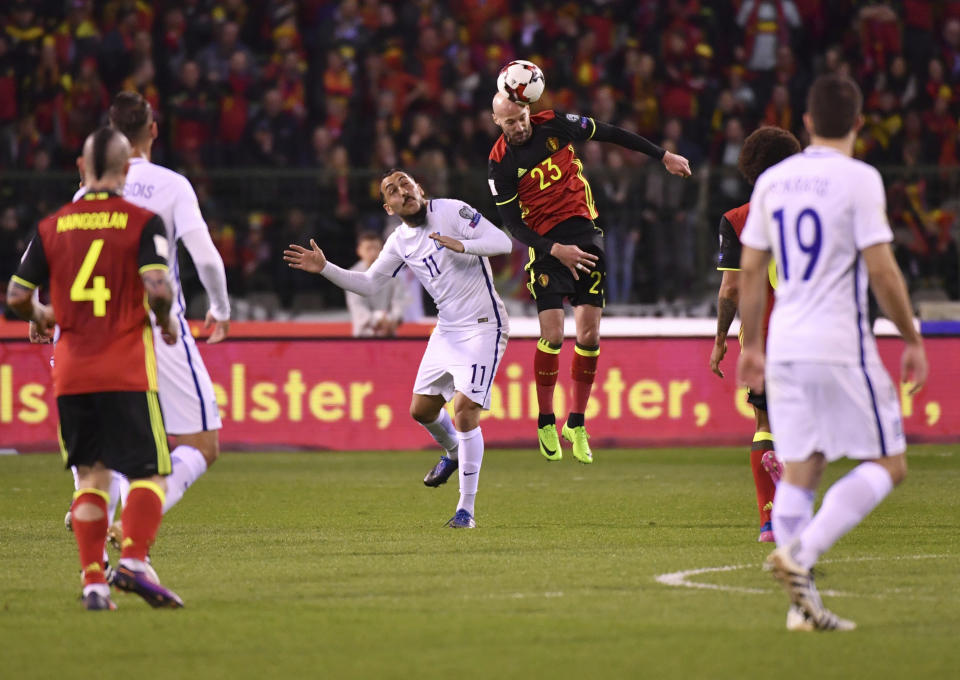 Belgium's Kevin Mirallas, center right, goes up against Greece's Kostas Mitroglou, center left, during the Euro 2018 Group H qualifying match between Belgium and Greece at the King Baudouin stadium in Brussels on Saturday, March 25, 2017. (AP Photo/Geert Vanden Wijngaert)