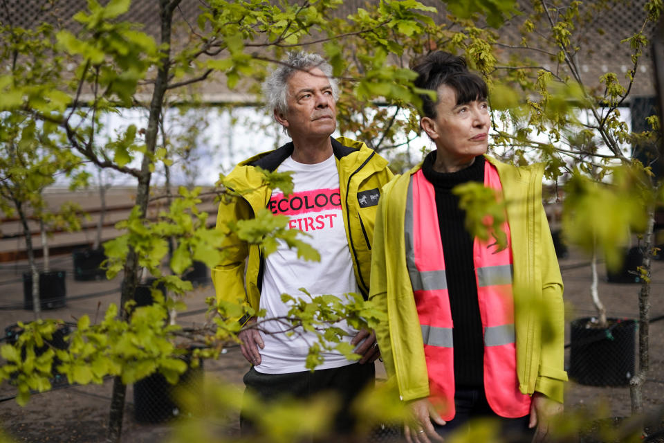 <p>Dan Harvey, left, and Heather Ackroyd pose amongst their installation of 100 oak tree saplings entitled Beuys' Acorns, on the terrace outside Tate Modern art gallery in London, Tuesday, May 4, 2021.  The project was started in 2007 by British artists Ackroyd & Harvey, with this display marking 100 years since the birth of Joseph Beuys (1921-86), the influential artist and environmental activist.(AP Photo/Alberto Pezzali)</p>
