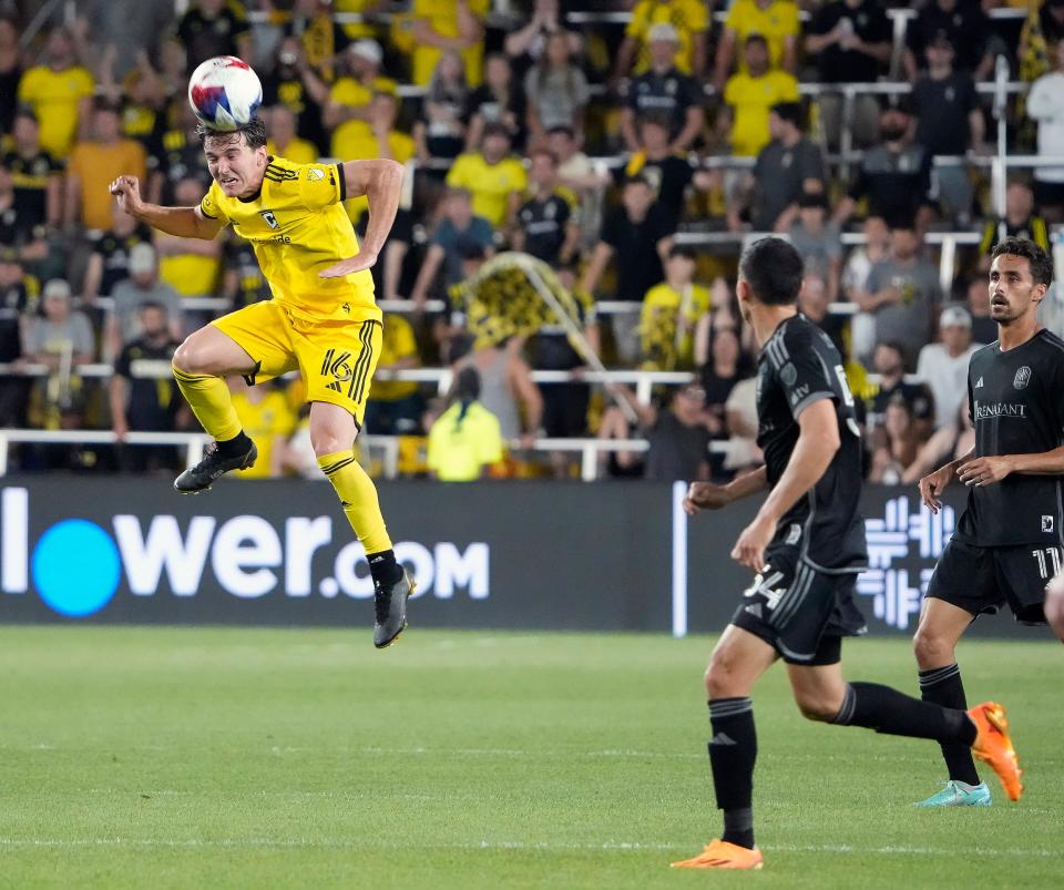 Jun 24, 2023; Columbus, Ohio, USA; Columbus Crew midfielder Isaiah Parente (16) goes up for a header against Nashville SC midfielder Sean Davis (54) in the second half during their MLS game at Lower.com Field. 