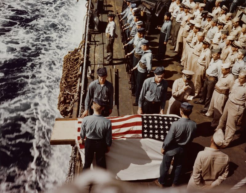 Burial at sea for a casualty of the battle for Iwo Jima onboard the USS Hansford