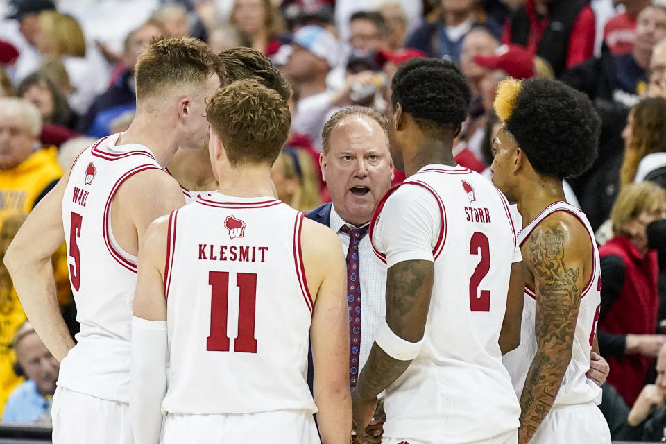 Wisconsin coach Greg Gard talks with his team in the final seconds of play against Marquette in an NCAA college basketball game Saturday, Dec. 2, 2023, in Madison, Wis. (AP Photo/Andy Manis)