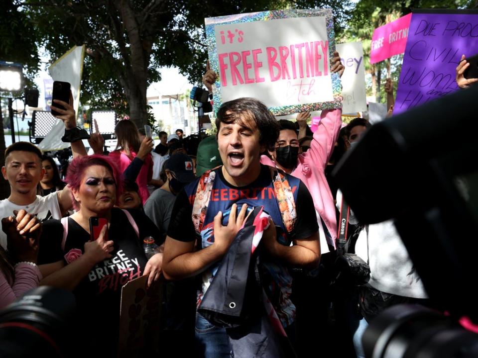 Fans react after hearing news that Britney Spears’s father has been removed by a judge as conservator of her estate on 29 September 2021 in Los Angeles (Kevin Winter/Getty Images)