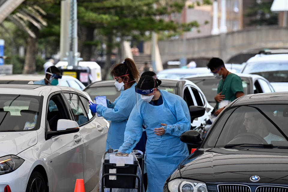 Healthcare workers administer COVID-19 tests at Bondi Beach. Source: AAP