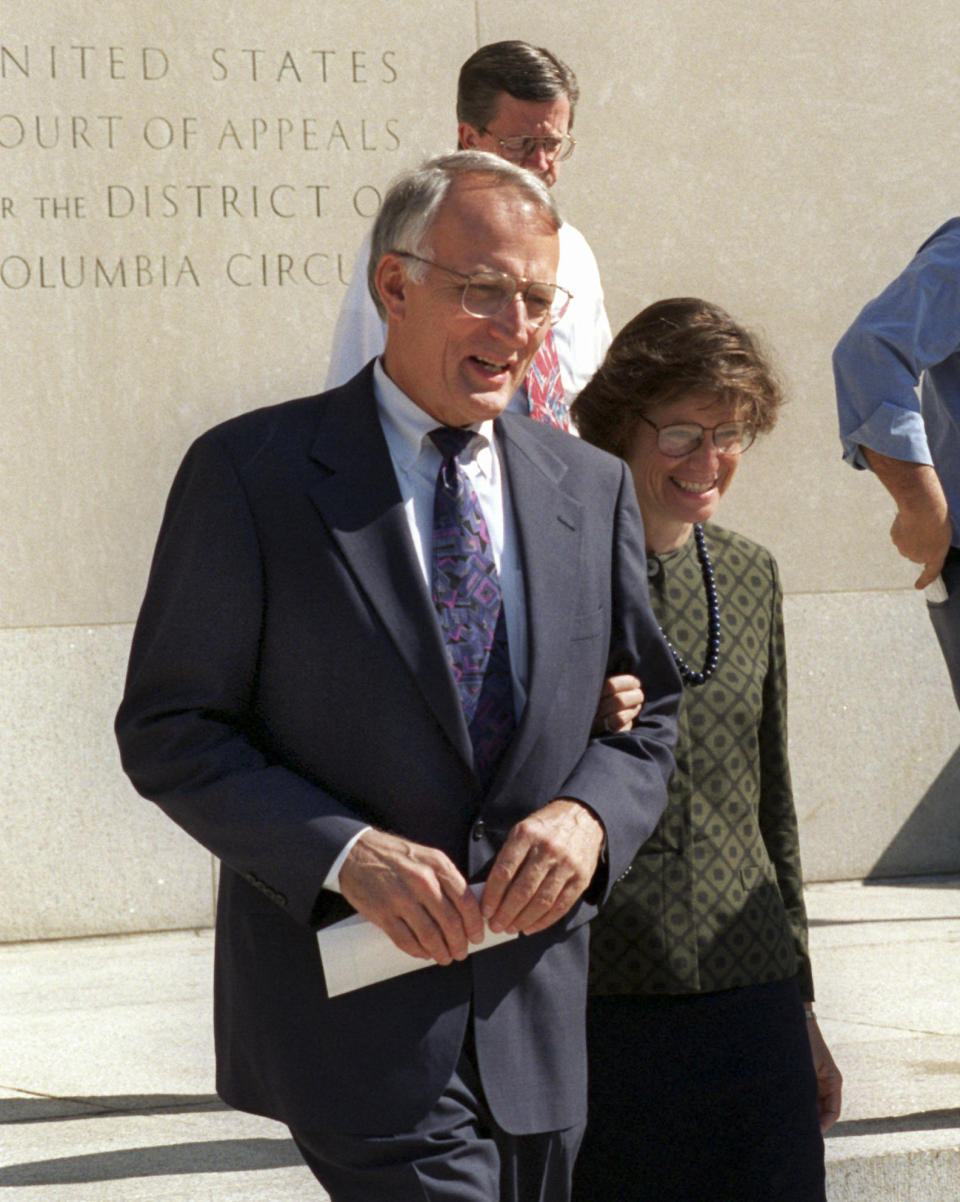 FILE - Former Minnesota Sen. David Durenberger and fiancee Susan Foote, leave federal court in Washington on Aug. 22, 1995, after Durenberger pleaded guilty to five misdemeanor charges involving the abuse of his congressional expense account. Durenberger, a Minnesota Republican who espoused a progressive brand of politics and criticized the GOP after his political career, died Tuesday, Jan. 31, 2023, at age 88. (AP Photo/Dennis Cook, File)