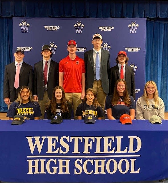 (Seated left to right): Westfield's Kalea Calugay, Alivia Macaluso, Avery Hoeft, Grace Klag and Izzy Gauthier. (Standing left to right): James Csorba, Eric Webb, Ryan Friedberg, Sean Logan and Luke Jacobs sign their National Letters of Intent on Wednesday, Nov. 10, 2021.