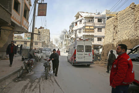 Smoke rises during evacuation in the besieged town of Douma, Eastern Ghouta, in Damascus, Syria March 19, 2018. REUTERS/Bassam Khabieh