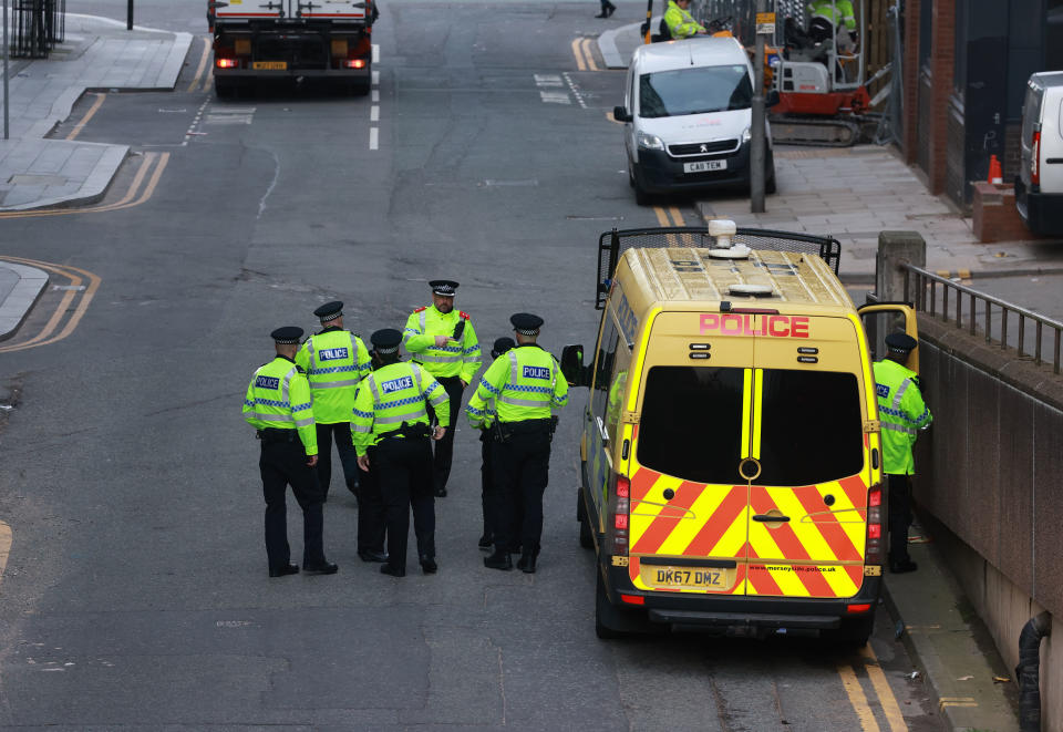 These are the first pictures of the man accused of murdering nine-year-old Olivia Pratt-Korbel.

Thomas Cashman, of Grenadier Drive in West Derby, Liverpool, appeared before Liverpool Magistrates' Court this morning [Oct 3].

Caption: Police outside Liverpool Crown Court on 3 October 2022 for the first appearance of Thomas Cashman, 34, of Grenadier Drive in West Derby, Liverpool, who has been charged with murder; two counts of attempted murder; and two counts of possession of a firearm with intent to endanger life 