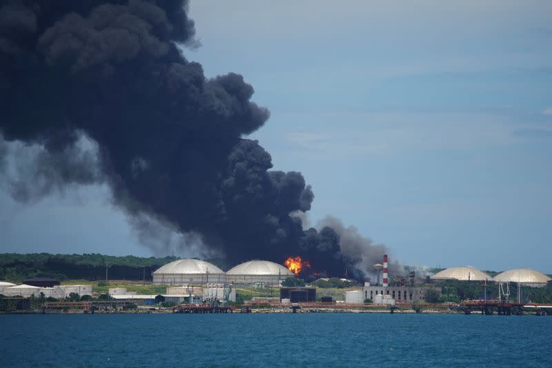 FILE PHOTO: Major fire spreads at Cuban fuel storage facility hit by lightning