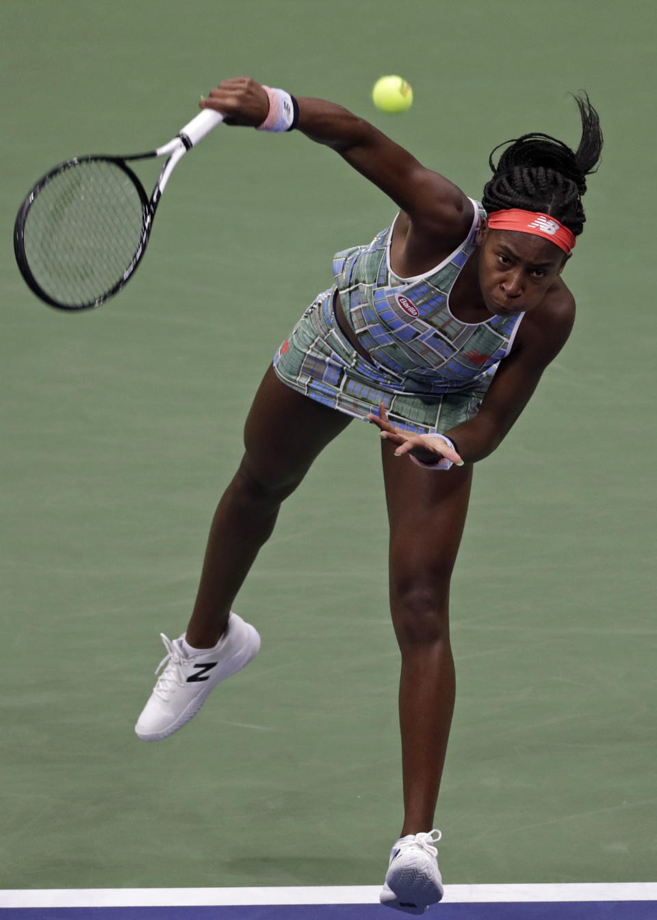 Coco Gauff serves to Naomi Osaka, of Japan, during the third round of the U.S. Open tennis tournament Saturday, Aug. 31, 2019, in New York. (AP Photo/Adam Hunger)