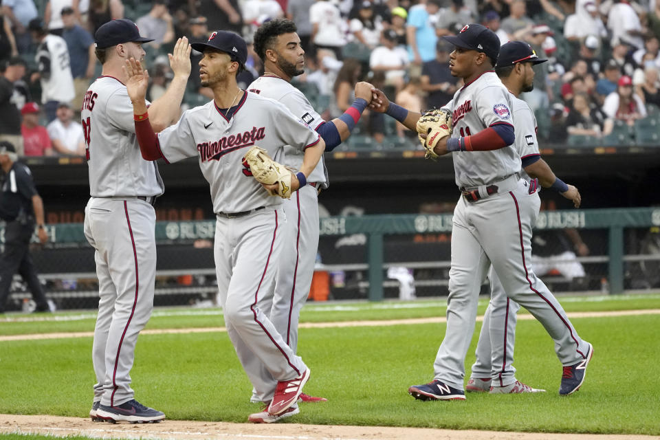 The Minnesota Twins celebrate the team's 3-2 win over the Chicago White Sox after a baseball game Monday, July 19, 2021, in Chicago. (AP Photo/Charles Rex Arbogast)