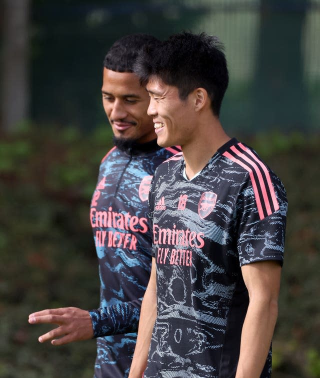 William Saliba, left, and Takehiro Tomiyasu in training