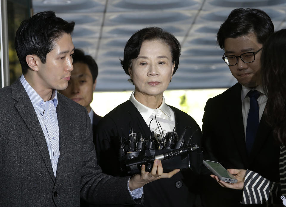 Lee Myung-hee, wife of the late Korean Air President Cho Yang-ho, center, arrives at the Seoul Central District Court in Seoul, Thursday, May 2, 2019. Lee on Thursday attended the opening trial on their charges including illegal hiring of a Filipino maid. (AP Photo/Ahn Young-joon)