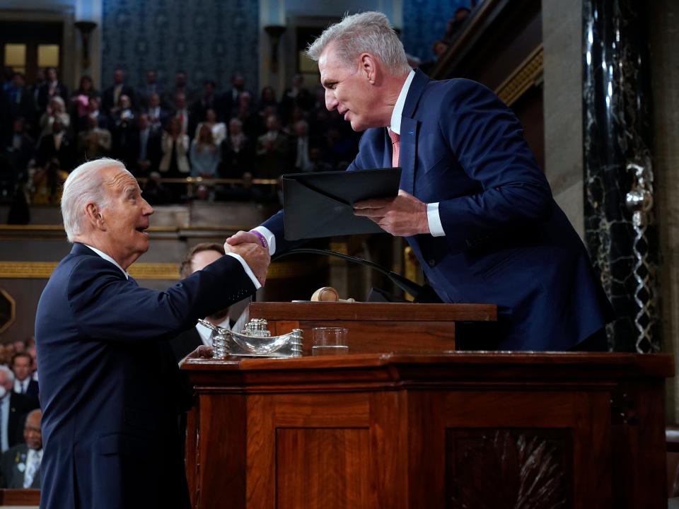 WASHINGTON, DC - FEBRUARY 07: US President Joe Biden shakes hands as he presents a copy of his speech to House Speaker Kevin McCarthy of Calif., before he delivers his State of the Union address to a joint session of Congress, on February 7, 2023 in the House Chamber of the U.S. Capitol in Washington, DC. The speech marks President Biden's first address to the new Republican-controlled House. (Photo by Jacquelyn Martin-Pool/Getty Images)