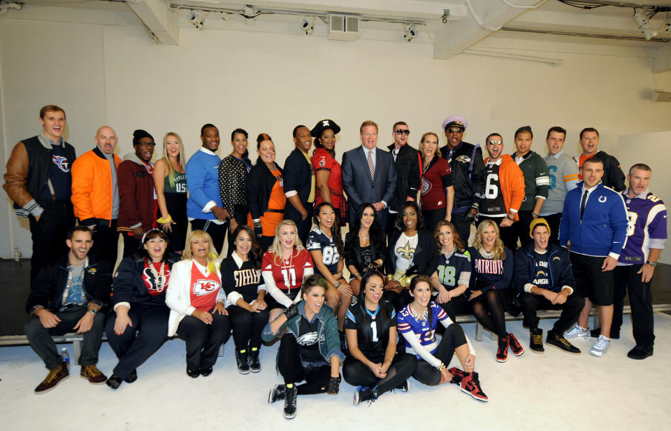 Commissioner Roger Goodell, center, is surrounded by one fan from each of the league's 32 teams who were chosen to take part in the NFL's Back to Football Photo Day, Tuesday, Sept. 4, 2012, in New York. (AP Photo/Henny Ray Abrams)