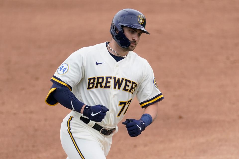 Milwaukee Brewers' Garrett Mitchell (77) runs the bases after hitting a home run during the third inning of a spring training baseball game against the Texas Rangers Saturday, March 13, 2021, in Phoenix. (AP Photo/Ashley Landis) ORG XMIT: AZAL111