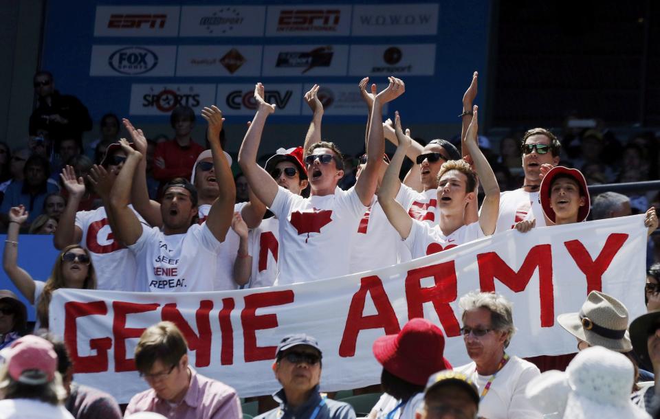 Supporters of Eugenie Bouchard of Canada, calling themselves the "Genie Army", cheer for her during her women's singles quarter-final match against Ana Ivanovic of Serbia at the Australian Open 2014 tennis tournament in Melbourne January 21, 2014. REUTERS/Jason Reed (AUSTRALIA - Tags: SPORT TENNIS)