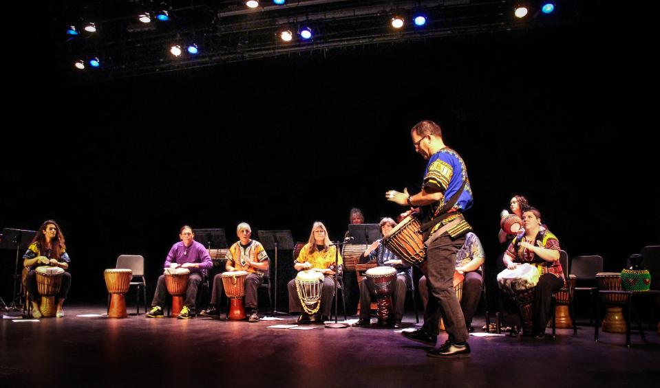 Music professor Teun Fetz, front, leads the San Juan College African drumming group in an end-of-semester concert this weekend on the college campus.