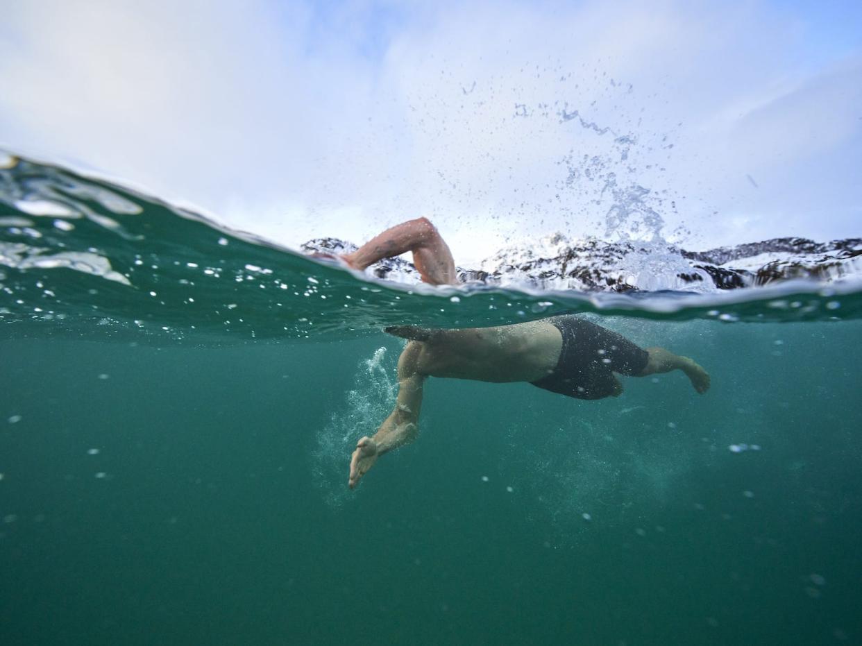 Actor Chris Hemsworth swims in freezing water in Norway