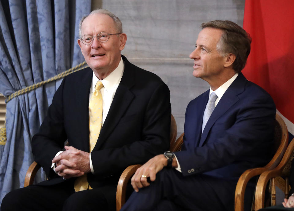 U.S. Sen. Lamar Alexander, R-Tenn., left, sits with outgoing Tennessee Gov. Bill Haslam during a ceremony unveiling Haslam's official portrait Monday, Dec. 17, 2018, in Nashville, Tenn. Alexander announced Monday he is not running for re-election in 2020. (AP Photo/Mark Humphrey)