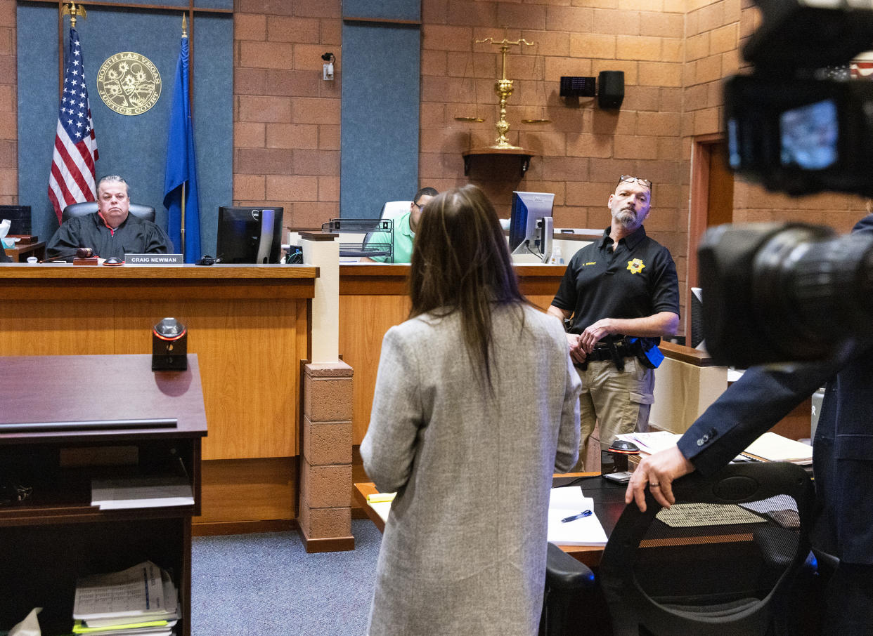 Kristy Holston, center, a public defender, representing former actor Nathan Lee Chasing His Horse, also known as Nathan Chasing Horse, addresses the court as North Las Vegas Justice of the Peace Craig Newman, left, looks on during Chasing Horse's bail hearing at North Las Vegas Justice Court, on Wednesday, Feb. 8, 2023. The judge on Wednesday set bail at $300,000 for the former “Dances With Wolves” actor charged in Nevada with sexually abusing and trafficking Indigenous women and girls. (Bizuayehu Tesfaye/Las Vegas Review-Journal via AP)