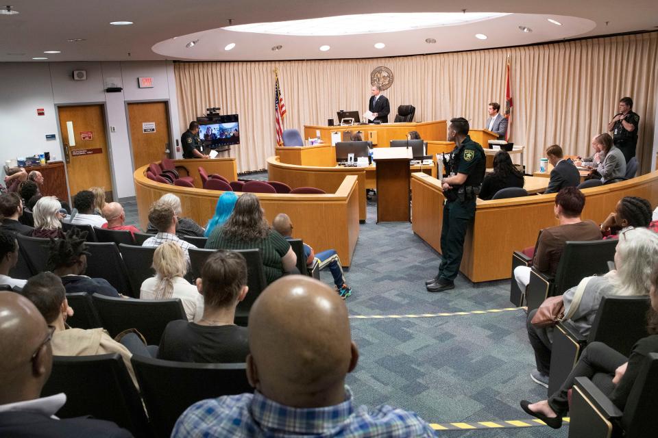 Escambia County Circuit Judge John Simon presides over video and in-person felony arraignment hearings on Friday, Feb. 24, 2023. The State Attorney's Office has amassed a backlog of court cases and is taking extra measures to clear the logjam.