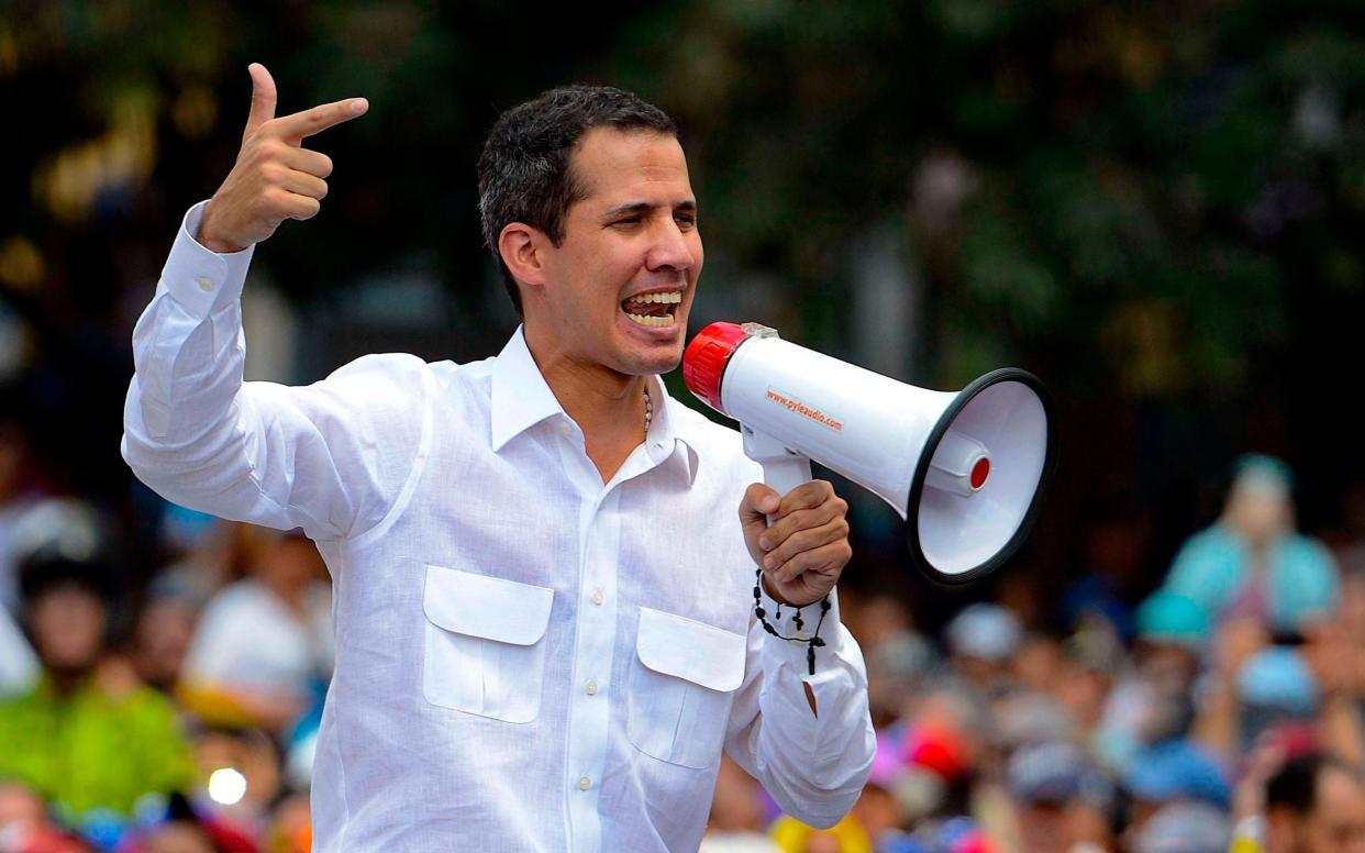 Venezuelan opposition leader and self-proclaimed acting president Juan Guaido speaks in Caracas - AFP