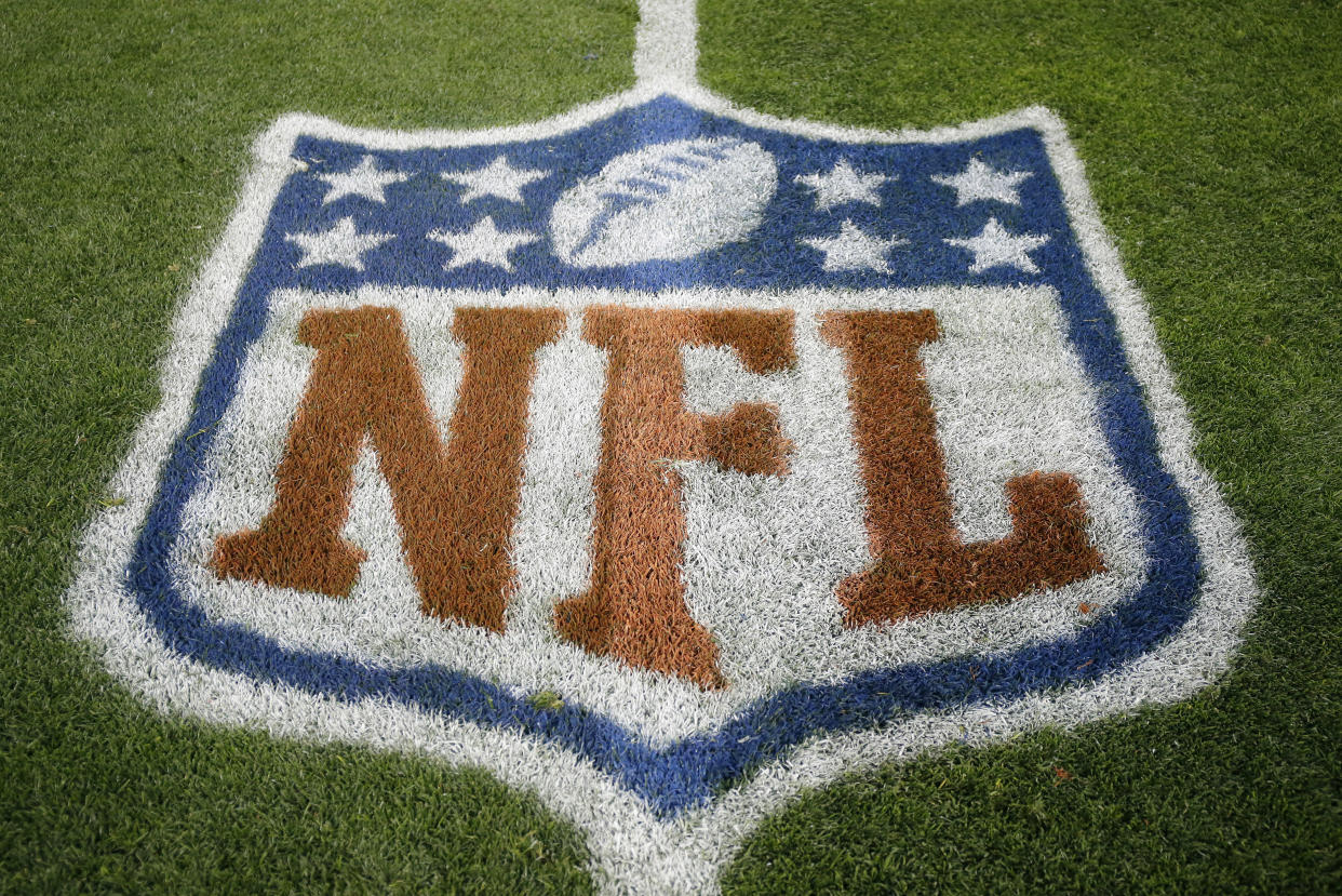 FILE – In this Nov. 12, 2017, file photo, an NFL logo is displayed on the field before an NFL football game between the New England Patriots and the Denver Broncos in Denver. Fox and the NFL have agreed to a five-year deal for Thursday night football games, Fox announced Wednesday, Jan. 31, 2018. Those games previously were televised by CBS and NBC, two of the league’s other network partners. (AP Photo/Jack Dempsey, File)