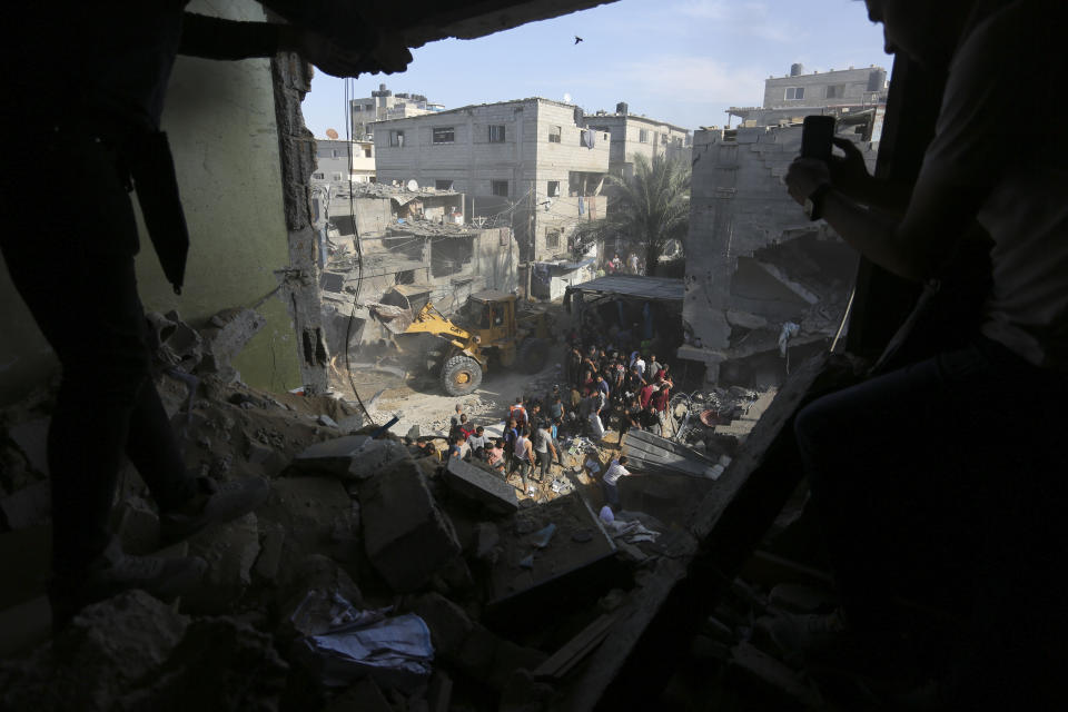Palestinians look for survivors fter an Israeli strike on the Gaza Strip in Rafah on Monday, Oct. 30, 2023. (AP Photo/Hatem Ali)