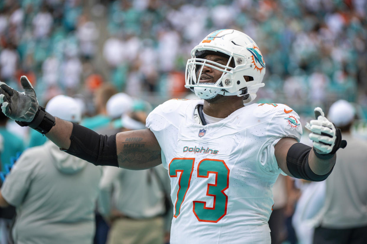 Miami Dolphins offensive lineman Austin Jackson (73) gestures on the sidelines during an NFL football game against the Denver Broncos, Sunday, Sept. 24, 2023, in Miami Gardens, Fla. (AP Photo/Doug Murray)