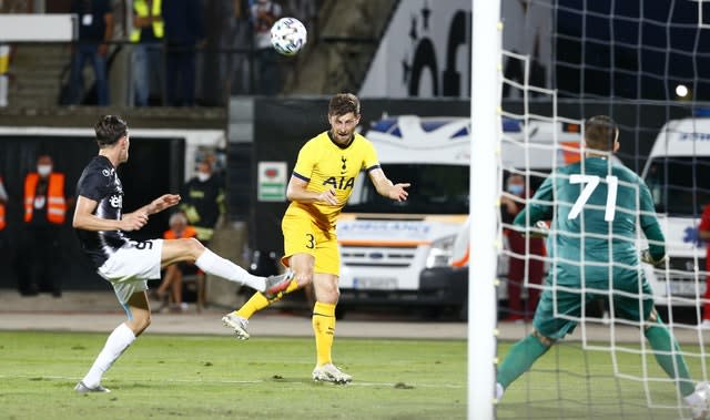 Tottenham’s Ben Davies challenges Lokomotiv’s Birsent Karagaren 