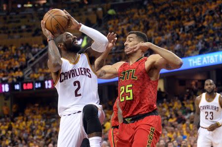 May 4, 2016; Cleveland, OH, USA; Cleveland Cavaliers guard Kyrie Irving (2) drives against Atlanta Hawks forward Thabo Sefolosha (25) during the first quarter in game two of the second round of the NBA Playoffs at Quicken Loans Arena. Mandatory Credit: Ken Blaze-USA TODAY Sports