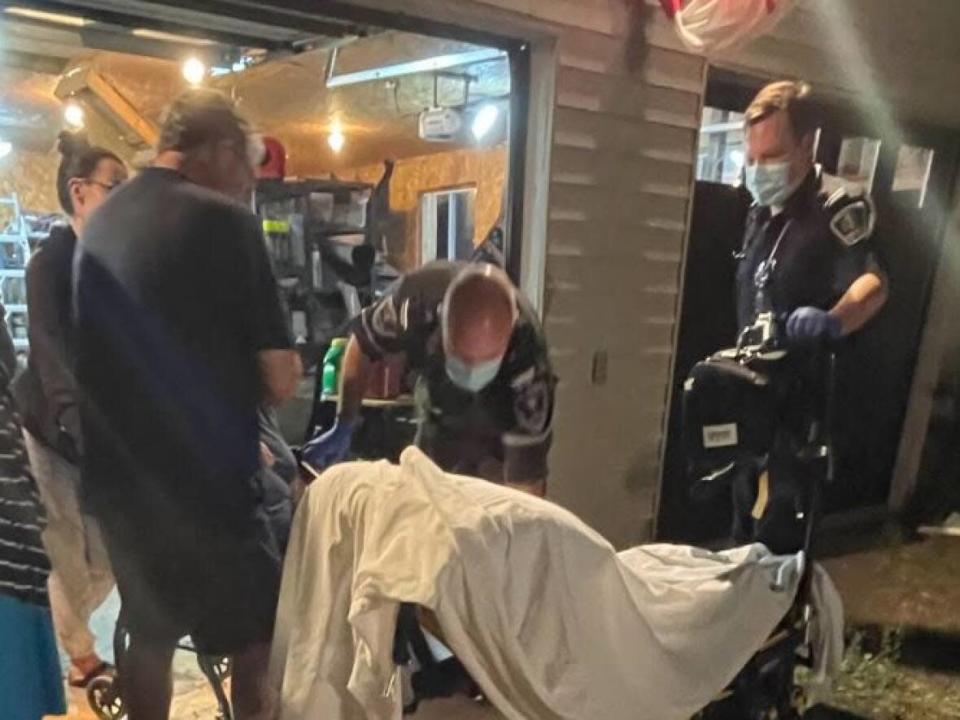 Six hours after 911 was called, an ambulance arrived and paramedics from outside Ottawa prepared a stretcher to transport Elaine Deschenes to hospital. (Cathy Deschenes/Submitted - image credit)
