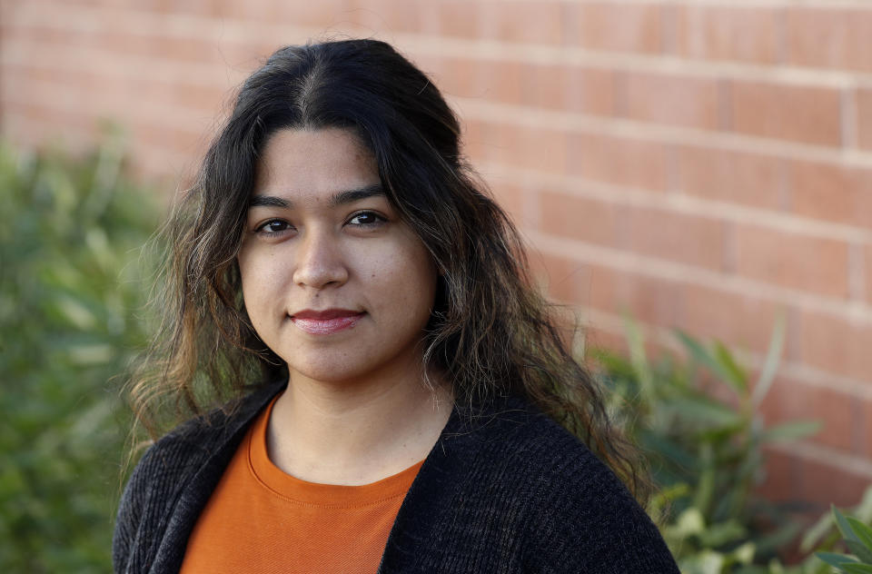 Maxima Guerrero poses for a photo in Phoenix on Wednesday, Jan. 23, 2019. Immigrants who were brought to the U.S. as children see little reason to be hopeful about the latest proposal to extend protections to them as part of President Donald Trump's plan to reopen the federal government. Guerrero, a Phoenix activist who has had Deferred Action for Childhood Arrivals program (DACA) protections since 2013, the court challenges, the politics and the perpetual debate involving the program has taken an emotional toll. (AP Photo/Matt York)