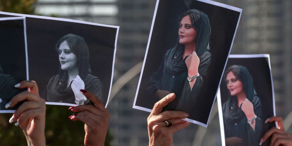 women hold up signs depicting the image of 22 year old mahsa amini, who died while in the custody of iranian authorities, during a demonstration denouncing her death by iraqi and iranian kurds outside the un offices in arbil, the capital of iraqs autonomous kurdistan region, on september 24, 2022   angry demonstrators have taken to the streets of major cities across iran, including the capital tehran, for eight straight nights since the death of 22 year old mahsa amini the kurdish woman was pronounced dead after spending three days in a coma following her arrest by irans feared morality police for wearing the hijab headscarf in an improper way photo by safin hamed  afp photo by safin hamedafp via getty images