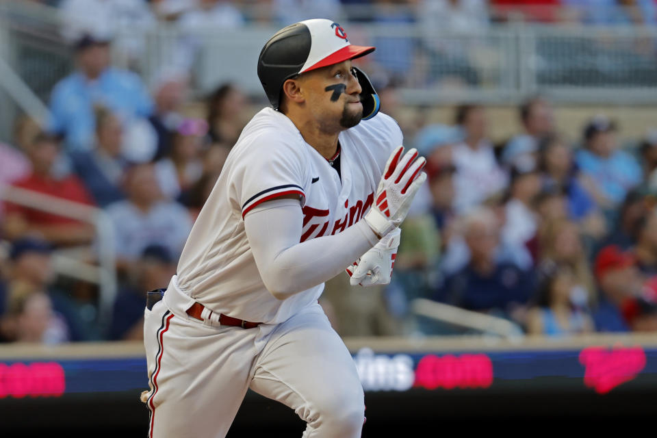 Minnesota Twins' Royce Lewis watches his double against the Texas Rangers during the fourth inning of a baseball game Thursday, Aug. 24, 2023, in Minneapolis. (AP Photo/Bruce Kluckhohn)