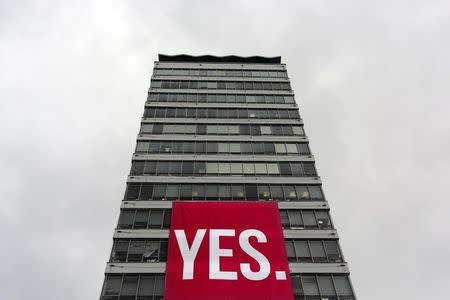 A large banner supporting a Yes vote hangs from a building in the Quays area of Dublin in Ireland May 19, 2015. REUTERS/Cathal McNaughton