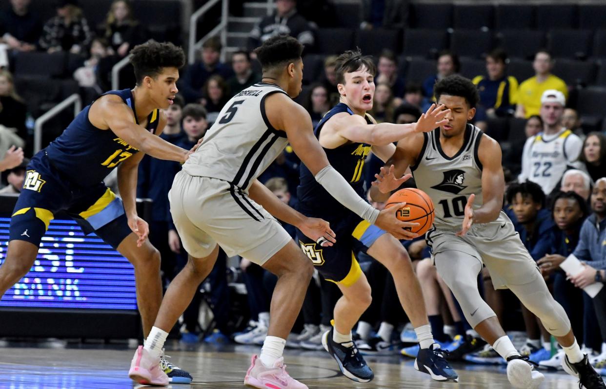 Marquette's Oso Ighodaro, left, played 45 minutes and Tyler Kolek fouled out in the second overtime last week against Providence in a game in which the Golden Eagles could have used some more help from the bench.