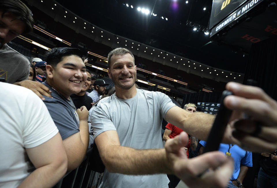 ANAHEIM, CA - AUGUST 14: Former UFC heavyweight champion Stipe Miocic takes a selfie with a fan after holding an open workout for fans and media at Honda Center on August 14, 2019 in Anaheim, California. (Photo by Kevork Djansezian/Zuffa LLC/Zuffa LLC)