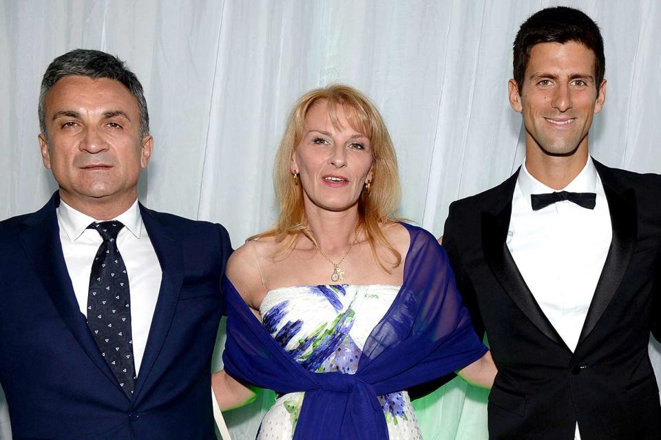 <p>Richard Young/Shutterstock </p> Novak Djokovic with his parents, Dijana and Srdjan, at the Novak Djokovic Foundation Gala Dinner in London on July 8, 2013.