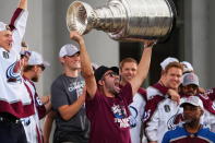 Colorado Avalanche center Nazem Kadri hoists the Stanley Cup at a rally for the NHL hockey champions Thursday, June 30, 2022, in Denver. (AP Photo/Jack Dempsey)