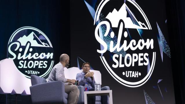 John Bowers, left, director of partnerships at Silicon Slopes, interviews Steve Young, former BYU and NFL quarterback, during the Silicon Slopes Summit at Vivint Arena in Salt Lake City on Friday, Sept. 30, 2022. WalletHub released the ranking of states that are the most innovative in the U.S.