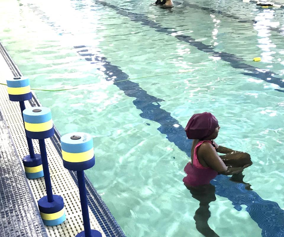 Taunton resident Jessica Alves completes a leg exercise while participating in a free adult swimming lesson class at the Old Colony YMCA in Taunton.