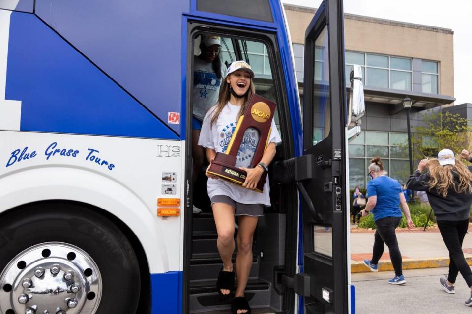 Kentucky star setter Madison Lilley carried the NCAA championship trophy when the Wildcats returned to Lexington.