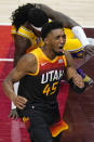 Utah Jazz guard Donovan Mitchell (45) reacts after blocking a shot by Los Angeles Lakers center Montrezl Harrell, rear, during the first half of an NBA basketball game Wednesday, Feb. 24, 2021, in Salt Lake City. (AP Photo/Rick Bowmer)